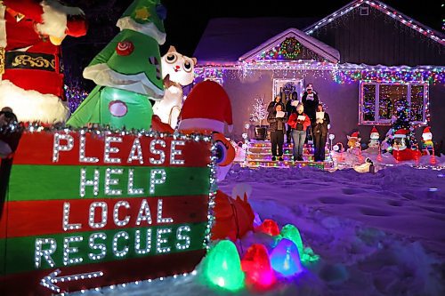 18122024
Singers with the Neelin Chamber Choir and Neelin Simple Green perform Christmas carols outside Patrick Stewart&#x2019;s brightly decorated home in the 500 block of 22nd Street in Brandon on a cold Wednesday evening. Stewart is collecting donations of food or cash for One At A Time Rescue, a local organization for orphaned animals.
(Tim Smith/The Brandon Sun)