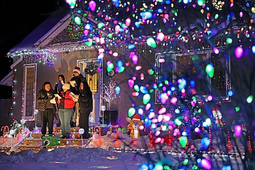 18122024
Singers with the Neelin Chamber Choir and Neelin Simple Green perform Christmas carols outside Patrick Stewart&#x2019;s brightly decorated home in the 500 block of 22nd Street in Brandon on a cold Wednesday evening. Stewart is collecting donations of food or cash for One At A Time Rescue, a local organization for orphaned animals.
(Tim Smith/The Brandon Sun)