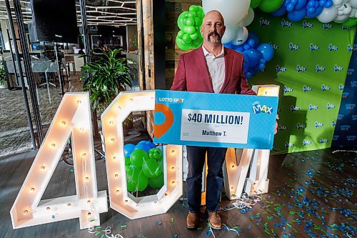 MIKE DEAL / FREE PRESS
Matthew Tannas shows off his $40M lottery win, one of the largest prizes ever won by a Manitoban at the new WCLC Head Office at (242 Hargrave Street) Thursday afternoon.
Matthew Tannas bought the ticket on his phone using the Western Canada Lottery Corporation Lotto Spot app and won half the Dec. 3 jackpot, splitting the $80-million prize with someone in Quebec. Both matched all seven numbers.
241219 - Thursday, December 19, 2024.