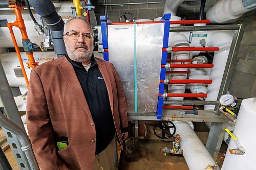 MIKE DEAL / FREE PRESS
J. Brian Blahey in the engine room at the Dakota Fieldhouse (1188 Dakota St) where he was the prime consultant on a complete engine room and ice plant refrigeration replacement.
J. Brian Blahey, runs JBB Consultants and Engineers, Inc., a one-man firm with a variety of professional design, engineering, construction and management experience. 
241219 - Thursday, December 19, 2024.