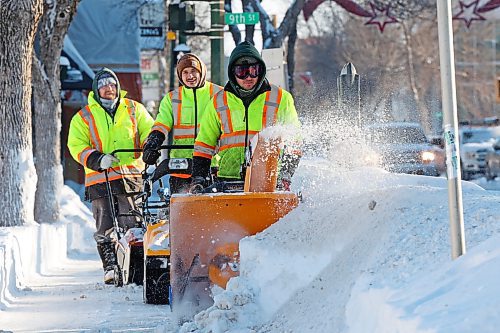 19122024
City of Brandon workers clear big snowdrifts from the sidewalk along Princess Avenue in downtown Brandon after yet another big overnight snowfall on Thursday.
(Tim Smith/The Brandon Sun)