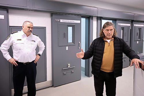 19122024
Brandon Mayor Jeff Fawcett chats with visitors touring the new detention cells at the Brandon Police Service headquarters in Brandon as BPS Deputy Chief Greg Hebert looks on. (Tim Smith/The Brandon Sun)