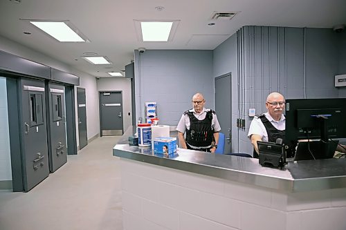 19122024
Commissioner Robert McKinnon and Warrant Officer Wade Gabriel work at the monitoring station in the new detention cell area at the Brandon Police Service headquarters in Brandon during a tour of the cells on Thursday. (Tim Smith/The Brandon Sun)