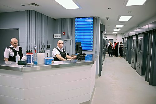 19122024
Commissioner Robert McKinnon and Warrant Officer Wade Gabriel work at the monitoring station in the new detention cell area at the Brandon Police Service headquarters in Brandon during a tour of the cells on Thursday. (Tim Smith/The Brandon Sun)