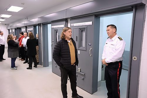 19122024
Brandon Mayor Jeff Fawcett chats with Brandon Police Service Chief Tyler Bates while touring the new detention cells at the Brandon Police Service headquarters in Brandon on Thursday. (Tim Smith/The Brandon Sun)