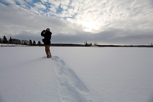 Ken Kingdon is looking for birds at the old Lakewood Hills golf course in Onanole. Kilometres of snowshoeing netted him about 15 sightings, which he will add to his tally for the area's Christmas Bird Count this year. (Connor McDowell/Brandon Sun)