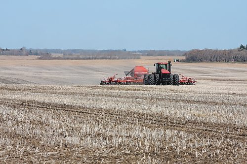 A farmer works at seeding a field northwest of Brandon in this file image.  (The Brandon Sun)