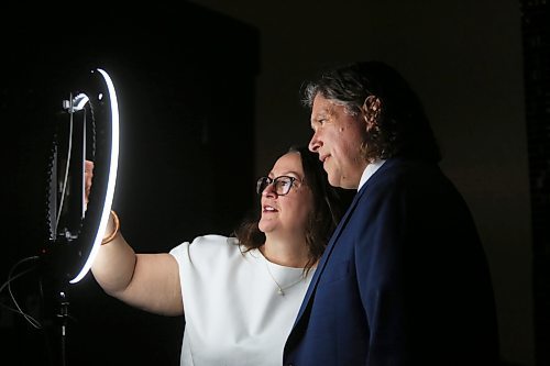 Jodi Fawcett looks through options on a computer screen after posing for a photo with her husband Brandon Mayor Jeff Fawcett at a special digital photo booth set up for the Provincial Exhibition of Manitoba's President's Dinner on Thursday evening at the Victoria Inn. (Matt Goerzen/The Brandon Sun)