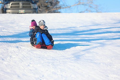 Eliza Katailo (left) and brother, Peter, enjoy a winter slide at Hanbury Hill on Sunday. The hill provides a long, enjoyable run for the older ages and a smaller run on the backside of the hill for younger children. (Abiola Odutola/The Brandon Sun)