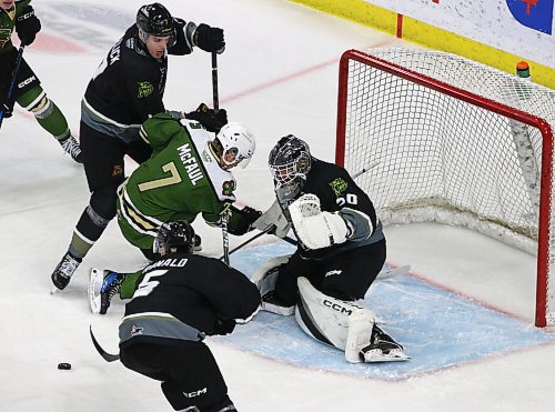 Brandon Wheat Kings goalie Alex Garrett watches as defenceman Dylan Ronald (5) scoops up the puck on a rebound as Charlie Elick (7) looks on and Swift Current Broncos forward Jace McFaul (7) congregate in front of the net. (Perry Bergson/The Brandon Sun)
Jan. 3, 2025