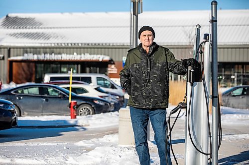 MIKAELA MACKENZIE / FREE PRESS
Jeff Mansfield, who has stopped using the Bill & Helen Norrie Library EV charging station since the app he uses to connect started charging him for the service, at the charger on Friday, Jan. 3, 2025.
For Nicole story.
Winnipeg Free Press 2024