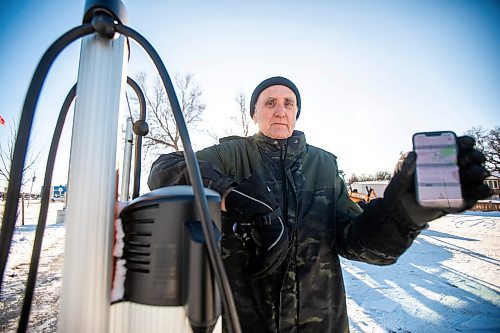 MIKAELA MACKENZIE / FREE PRESS
	

Jeff Mansfield, who has stopped using the Bill &amp; Helen Norrie Library EV charging station since the app he uses to connect started charging him for the service, at the charger on Friday, Jan. 3, 2025.

For Nicole story.
Winnipeg Free Press 2024