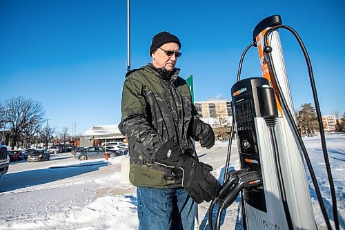 MIKAELA MACKENZIE / FREE PRESS
	

Jeff Mansfield, who has stopped using the Bill &amp; Helen Norrie Library EV charging station since the app he uses to connect started charging him for the service, at the charger on Friday, Jan. 3, 2025.

For Nicole story.
Winnipeg Free Press 2024