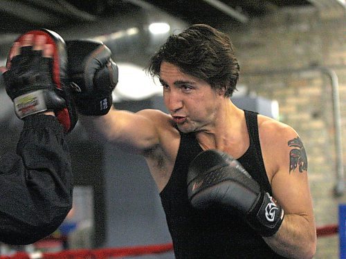 Federal Liberal leadership candidate Justin Trudeau  atPan Am Boxing Club with owner Harry Black during his boxing work out session at the&#x2013; He will take place in a leadership candidate debate at 1 p.m. at the Metropolitan Theatre in Winnipeg Saturday afternoon.- February 01, 2013   (JOE BRYKSA / WINNIPEG FREE PRESS)