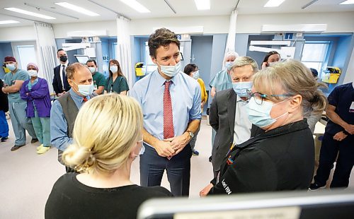 MIKE DEAL / WINNIPEG FREE PRESS
Prime Minister, Justin Trudeau, along with Kevin Lamoureux (left), MP for Winnipeg North, and Terry Duguid (right), MP for Winnipeg South, visit health care workers at the Grace Hospital Friday afternoon.
230303 - Friday, March 03, 2023.
