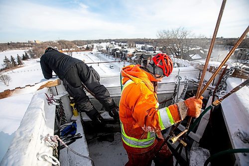 MIKAELA MACKENZIE / FREE PRESS
	

Rolly Magne (left) and Charles Roy adjust the water for optimal ice creation at the St. Boniface ice climbing tower on Monday, Jan. 6, 2025. The system needs to be checked three times a day while running, and it usually takes about two weeks to create the finished tower. Temperatures need to be below -15C to build up ice, so these folks may be one of the few not looking forward to the warmer days forecasted ahead.

Standup.
Winnipeg Free Press 2025
