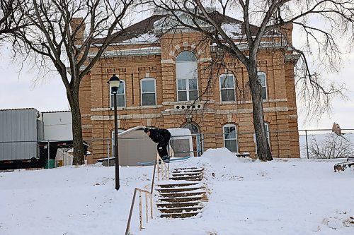 Alex Hall, an American gold-medal Olympic trick skier, grinds a handrail leading down a flight of stairs in Rideau Park. (Connor McDowell/The Brandon Sun)