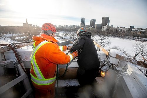 MIKAELA MACKENZIE / FREE PRESS
	

Charles Roy (left) and Rolly Magne adjust the water for optimal ice creation at the St. Boniface ice climbing tower on Monday, Jan. 6, 2025. The system needs to be checked three times a day while running, and it usually takes about two weeks to create the finished tower. Temperatures need to be below -15C to build up ice, so these folks may be one of the few not looking forward to the warmer days forecasted ahead.

Standup.
Winnipeg Free Press 2025
