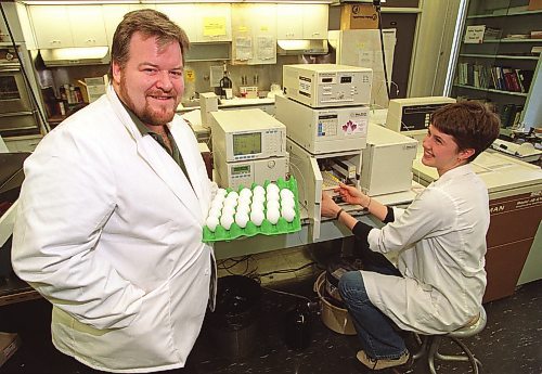 BORIS MINKEVICH/WINNIPEG FREE PRESS  Animal science prof Dr. Jim House holds a tray of eggs while masters student Desmond Ballance is at the HPLC high presure liquid chromatography machine(worth $80,000). House did the study on measuring folate levels in eggs. Ballance was involved and worked on the project as well.