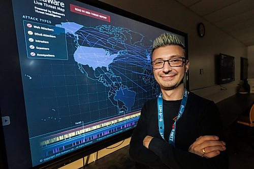 MIKE DEAL / FREE PRESS
Jared Miskimmin, MITT&#x2019;s program manager of information communication and digital technologies and skilled trades stands in front of a cyber security threat map in one of the schools computer labs. MITT is launching a cybersecurity analyst diploma program this fall, and a medical assistant and patient care diploma.
Reporter: Gabrielle Piche
250108 - Wednesday, January 08, 2025.