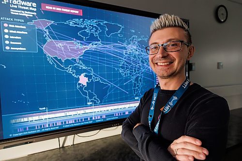 MIKE DEAL / FREE PRESS
Jared Miskimmin, MITT&#x2019;s program manager of information communication and digital technologies and skilled trades stands in front of a cyber security threat map in one of the schools computer labs. MITT is launching a cybersecurity analyst diploma program this fall, and a medical assistant and patient care diploma.
Reporter: Gabrielle Piche
250108 - Wednesday, January 08, 2025.