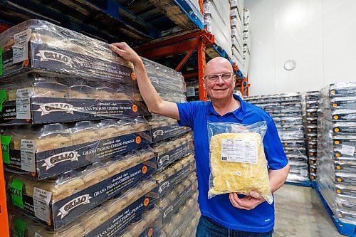 MIKE DEAL / FREE PRESS
Tom De Nardi, president of Mondo Foods, holds a bag of Mondo Special Mozzarella and White Cheddar Blend from New Zealand while in one of Mondo’s many coolers surrounded by pallets of Shredded Italian Gran Padano Cheese.
Tom De Nardi, president of Mondo Foods, which imports food for distribution throughout Canada, has faced hurdles on cheese imports due to changed government regulation. Government quota rules have led to lost business at Mondo and an unfair playing field within the cheese import industry, which leads to food inflation, Tom said.
Reporter: Gabrielle Piche
250113 - Monday, January 13, 2025.