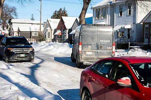 MIKAELA MACKENZIE / FREE PRESS
	

An Amazon Delivery van stops to make a drop-off on a residential street on Tuesday, Jan. 14, 2025.  

For bad parking story.
Winnipeg Free Press 2025