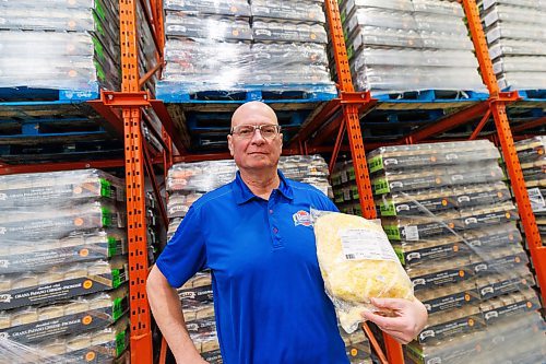 MIKE DEAL / FREE PRESS
Tom De Nardi, president of Mondo Foods, holds a bag of Mondo Special Mozzarella and White Cheddar Blend from New Zealand while in one of Mondo’s many coolers surrounded by pallets of Shredded Italian Gran Padano Cheese.
Tom De Nardi, president of Mondo Foods, which imports food for distribution throughout Canada, has faced hurdles on cheese imports due to changed government regulation. Government quota rules have led to lost business at Mondo and an unfair playing field within the cheese import industry, which leads to food inflation, Tom said.
Reporter: Gabrielle Piche
250113 - Monday, January 13, 2025.