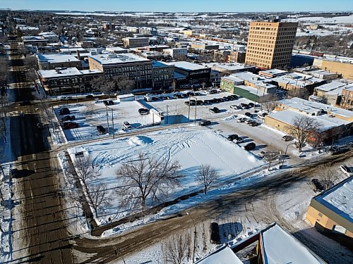 Empty lots along Princess Avenue between 10th Street and 9th Street in downtown Brandon as seen from above. An empty lot on the corner of 9th Street and Princess Avenue is being prospected as the site of a 90-unit residential building, City of Brandon's director of planning Ryan Nickel said on Wednesday. (Tim Smith/The Brandon Sun)