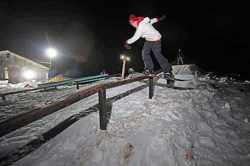 15012025
Alex Misanchuk boardslides a rail in a backyard park at Chris Campbell&#x2019;s home along 17th Avenue East in Brandon on a mild Wednesday evening. Campbell and friends built the majority of the park before the snow fell and he and his friends have been riding since the first snowfall. 
(Tim Smith/The Brandon Sun)