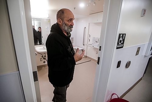 JOHN WOODS / FREE PRESS
Kelly Johnson, a guest, shows off a newly renovated shower room as people attend Oak Table/Just A Warm Sleep overnight shelter in Osbourne Village Tuesday, January 14, 2025. Just A Warm Sleep, an overnight shelter in Osborne Village that recently made renovations to provide a safe, dignified place to stay for homeless people. Accessible showers, individual washrooms, lockers, phone chargers and a community kitchen and dining room are some amenities at the shelter and breaks the mould of what traditional overnight shelters in Winnipeg can look like.
Reporter: nicole