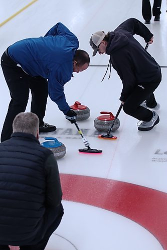 Mark Anderson's team brings a rock into the house in the men's B-side final of the Wheat City Classic at the Riverview Curling Club on Sunday. (Matt Packwood/The Brandon Sun)