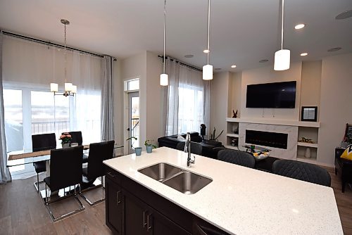 Todd Lewys / Free Press
Large windows on the main living area&#x2019;s rear wall allow tons of natural light to fill the warm, inviting area.