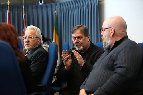 Brandon Coun. Shawn Berry motions with his hands while talking with other councillors during a break in 2025 budget deliberations on Saturday at Brandon City Hall. (Matt Goerzen/The Brandon Sun)
