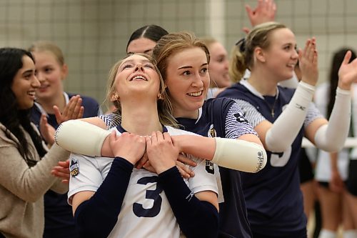 Setter Carly Thomson hugs libero Brooklyn Pratt (3) after the Brandon University Bobcats beat the country's No. 2-ranked women's volleyball team, the Fraser Valley Cascades, at the Healthy Living Centre on Saturday. (Thomas Friesen/The Brandon Sun)