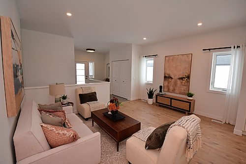 Todd Lewys / Free Press
Natural light floods into the cosy great room from a pair of large windows on either side of the recessed entertainment unit.