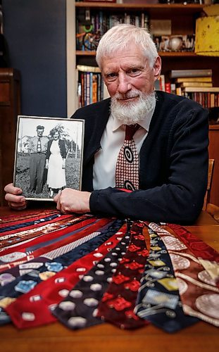 JOHN WOODS / FREE PRESS
Paul Rempel, who collects ties from the 1940s, shows some of his collection with a photo of his parents David and Kathryn at his home Tuesday, January 28, 2025.
Reporter: dave