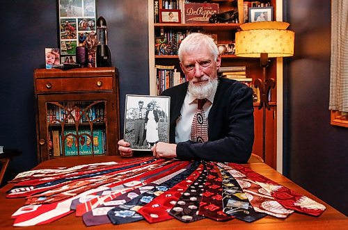 JOHN WOODS / FREE PRESS
Paul Rempel, who collects ties from the 1940s, shows some of his collection with a photo of his parents David and Kathryn at his home Tuesday, January 28, 2025.
Reporter: dave