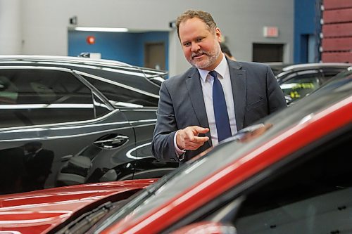 MIKE DEAL / FREE PRESS
Matt Wiebe, Minister of Justice and Attorney General of Manitoba, checks out the cars that were seized during the operation.
Matt Wiebe, Minister of Justice and Attorney General of Manitoba, Superintendent Cam Mackid, Investigations, Winnipeg Police Service and Satvir Jatana, President and CEO of Manitoba Public Insurance, hold a joint press conference at the MPI Physical Damage Centre (1981 Plessis Road), Friday afternoon to showcase a number of vehicles that were seized as part of an investigation by Manitoba Public Insurance and the Winnipeg Police Service. Working together in what is dubbed, Project Buyer Bee Aware, MPI and the WPS shut down a large auto theft operation in Winnipeg that had connections to vehicles stolen from Ontario.
Reporter: Scott Billeck
250131 - Friday, January 31, 2025.