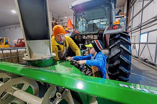 MIKE DEAL / FREE PRESS
Colin Penner, a grain farmer southwest of Winnipeg, with his son Everett, 8, working in the shop. Colin has had to think about the impact of possible tariffs and work on the diversity of his crops, and his stocks of fuel and fertilizer and look at other measures to build resilience in his business.
Reporter: Julia-Simone Rutgers
250131 - Friday, January 31, 2025.