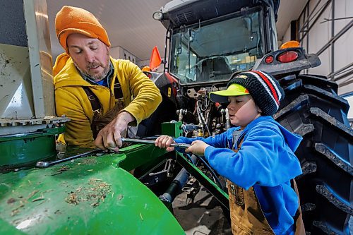 MIKE DEAL / FREE PRESS
Colin Penner, a grain farmer southwest of Winnipeg, with his son Everett, 8, working in the shop. Colin has had to think about the impact of possible tariffs and work on the diversity of his crops, and his stocks of fuel and fertilizer and look at other measures to build resilience in his business.
Reporter: Julia-Simone Rutgers
250131 - Friday, January 31, 2025.