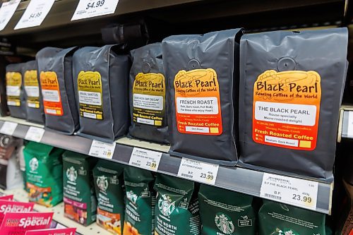 MIKE DEAL / FREE PRESS
Winnipeg&#x2019;s Black Pearl coffee roasters have been around for many years.
Tarik Zeid, manager at Food Fare Silver Heights (2285 Portage Ave), puts up Made in Canada signage to help consumers determine what is Canadian and what is American.
Reporter: Scott Billeck
250203 - Monday, February 03, 2025.