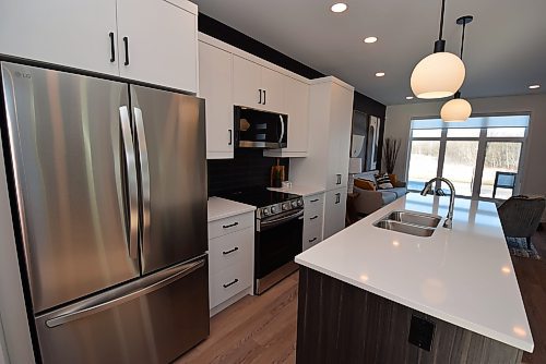 Todd Lewys / Free Press
A huge window on the great room&#x2019;s rear wall allows loads of natural light to flood into the adjacent island kitchen, and beyond.