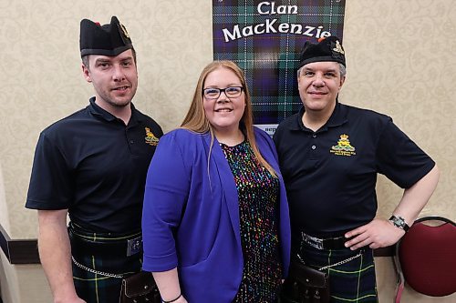 26th Field Regiment Pipes 7 Drums members Grayson Ross (LEFT), Tyler Foster (right), and Westman Scottish Association President Sarah-Jane Speers (middle) pose for picture at the Scottish Pavilion Saturday afternoon. (Abiola Odutola/The Brandon Sun) 