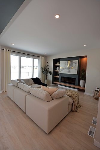 Todd Lewys / Free Press
The gorgeous entertainment centre featuring a linear-electric fireplace serves as the main living area’s signature space.