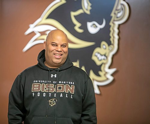 BROOK JONES/FREE PRESS
The University of Manitoba Bisons football team's newly minted head coach Stan Pierre, 53, is pictured in front of a Bison logo at Princess Auto Stadium in Winnipeg, Man., Monday, Feb. 10, 2025.