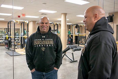 BROOK JONES/FREE PRESS
The University of Manitoba Bisons football team's newly minted head coach Stan Pierre, 53, is pictured looking at his reflection in a mirror as he stands in the weight room inside the Bison Football complex at Princess Auto Stadium in Winnipeg, Man., Monday, Feb. 10, 2025. Pierre who was named head coach on Jan. 17 was reflecting on his time as long-time defensive coordinator and assistant head coach under the leadeship of now retried Bisons football team head coach Brian Dobie.