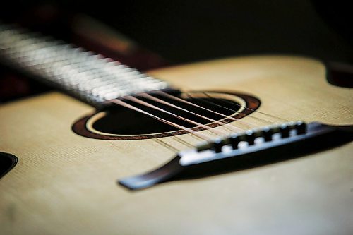 JOHN WOODS / FREE PRESS
One of Phil Campbell-Enns’ guitars is photographed in his basement workshop Tuesday, February 11, 2025. Campbell-Enns, a pastor at Home Street Mennonite Church, side hustle is building acoustic guitars in his basement workshop.

Reporter: dave