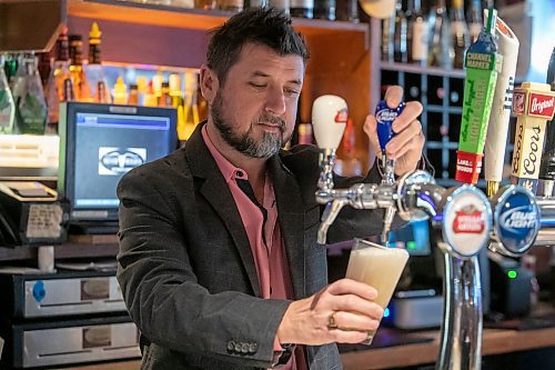 BROOK JONES/FREE PRESS
Tony Siwicki, 48, chair of the Manitoba Restaurant &amp; Foodservices Association and owner of Silver Heights Restaurant, pours a drink behind the bar as he is inside the restaurant and lounge at 2169 Portage Ave. in Winnipeg, Man., Friday, Feb. 14, 2025.