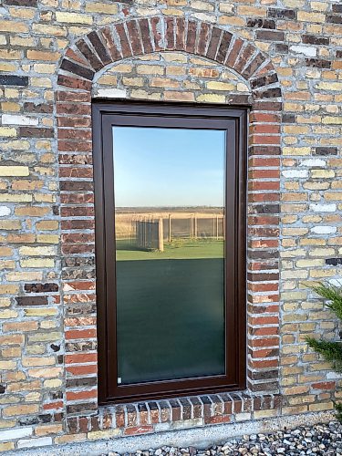 Marc LaBossiere / Free Press
The semi-translucent vinyl film applied to the interior of the window glass adds privacy without changing the look of the window.